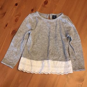 Girls long sleeve shirt with white embroidered hem